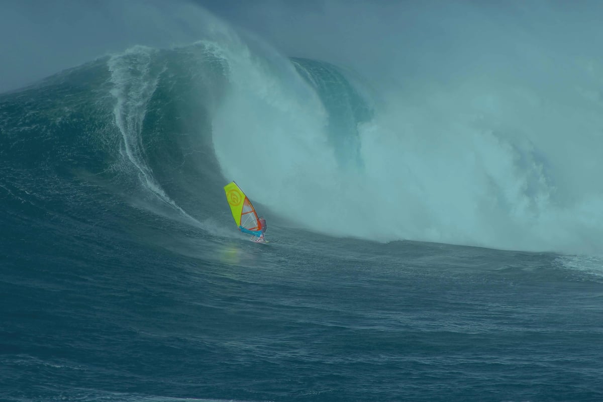 Kite surfer on tall wave